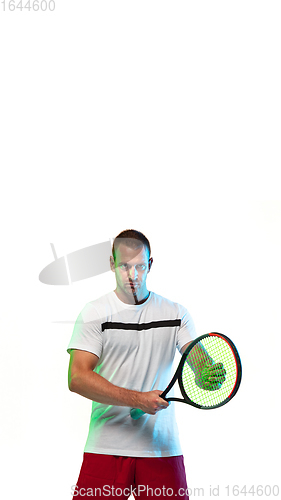 Image of Man playing tennis isolated on white studio background in neon light, vertical flyer
