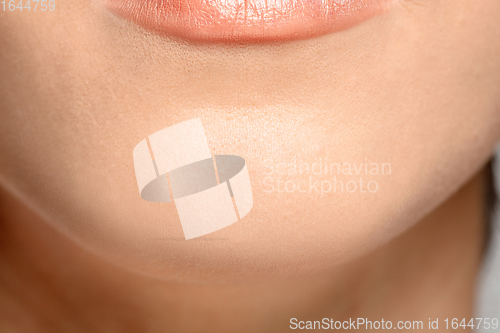 Image of Close up portrait of beautiful jewish woman isolated on studio background. Beauty, fashion, skincare, cosmetics concept. Details.