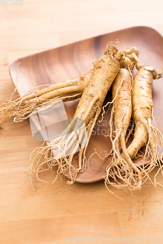 Image of Ginseng over wooden background
