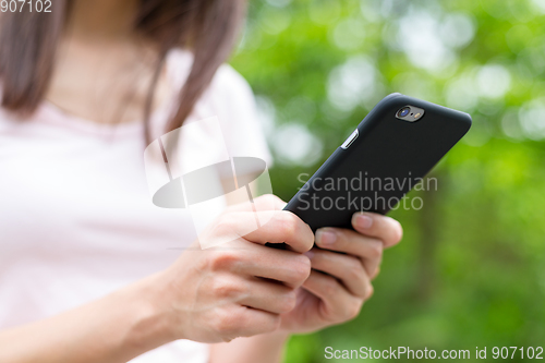 Image of Woman hand using smart phone