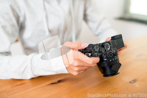 Image of Woman using digital camera