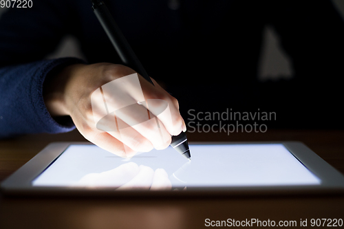 Image of Woman using pen deisgn on tablet pc