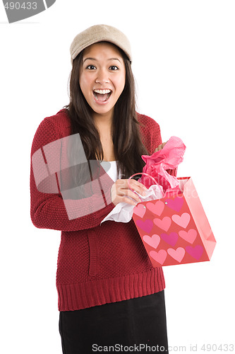 Image of Surprised asian girl receiving valentine gift