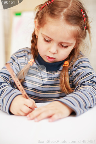 Image of Cute little girl painting at home