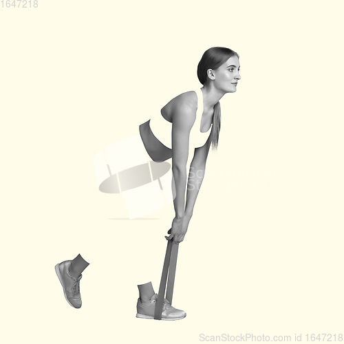 Image of Young caucasian sportswoman isolated on studio background, modern artwork. Healthy lifestyle, movement, action, motion, advertising and sports concept. Abstract design.