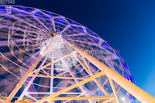 Image of Ferris Wheel at amusement park during evening