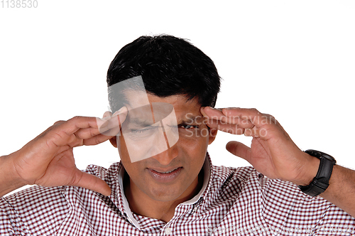 Image of Man with severe headache holding his head