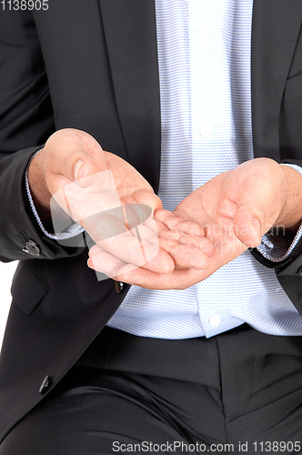 Image of Man holding his hands open, closeup body part