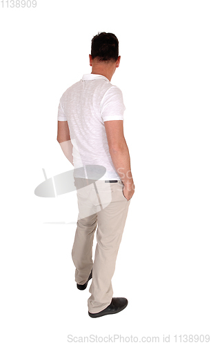 Image of Man standing relaxed in casual clothing from the back