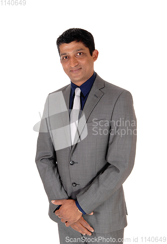 Image of Middle age business man in gray suit and tie