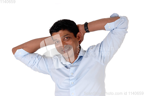 Image of Closeup on a Indian man hands behind his head