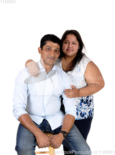 Image of Happy East Indian couple embracing each other