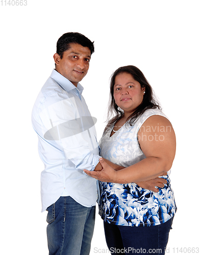 Image of Happy East Indian couple standing, looking into camera