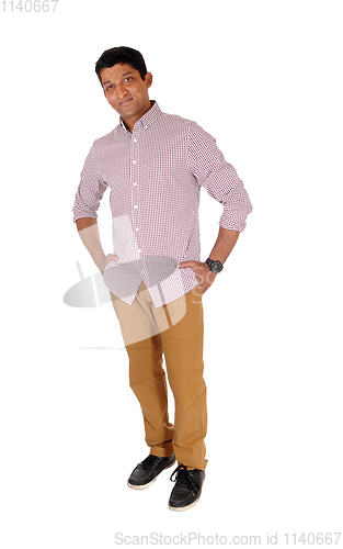 Image of Man standing relaxed in red checkered shirt 