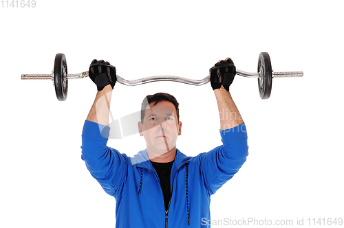 Image of Tall man lifting the weight in blue jacket