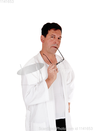 Image of Tall handsome man in white bathrobe