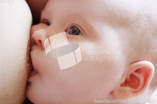 Image of mother breastfeeding baby