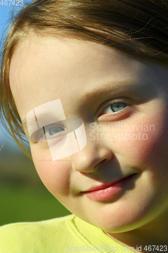 Image of portrait of little beautiful girl with blue eyes