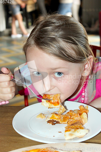 Image of girl eating pizza