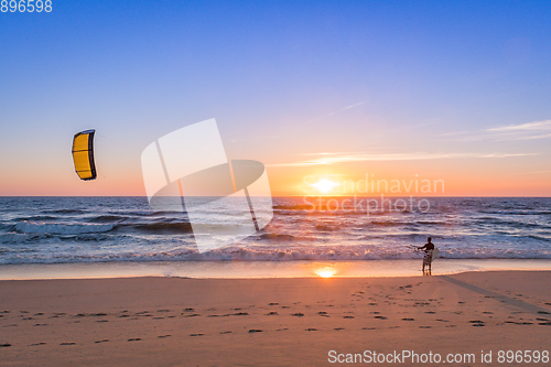 Image of Kite surfer watching the waves