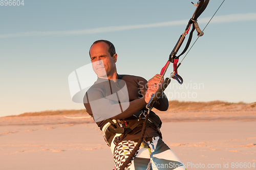 Image of Kite surfer watching the waves