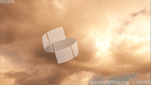 Image of Time lapse Fluffy clouds float across the blue sky.