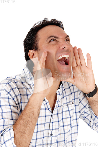 Image of Caucasian man shouting with hands on mouth