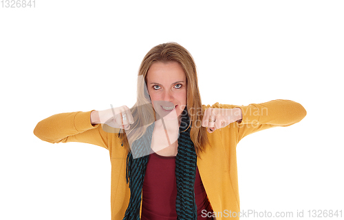 Image of Angry woman making her fists, looking frustrated 