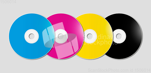 Image of CMYK CD - DVD set on grey background