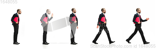 Image of Handsome businessman with red folder in motion isolated over white studio background. Collage