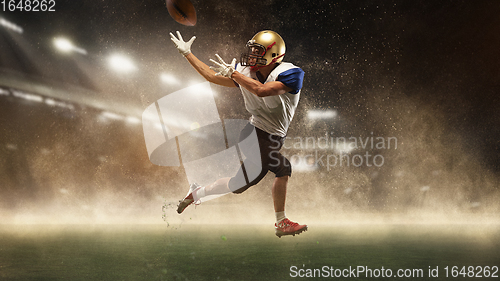 Image of Young man american football player at stadium in motion. Action, activity, sportlife concept. Flyer for ad, design.