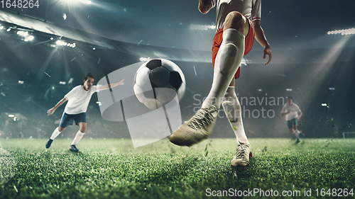 Image of Close-up football or soccer players at stadium - motion, action, activity concept. Flyer for ad, design.