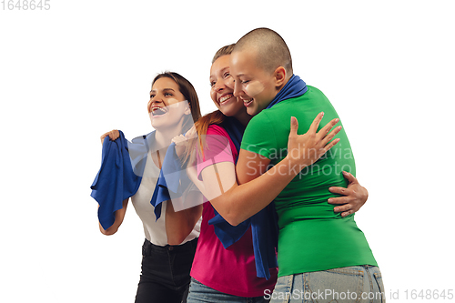 Image of Female soccer fans cheering for favourite sport team with bright emotions isolated on white studio background