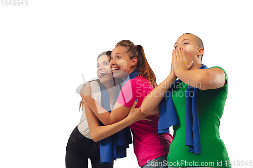 Image of Female soccer fans cheering for favourite sport team with bright emotions isolated on white studio background