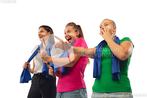 Image of Female soccer fans cheering for favourite sport team with bright emotions isolated on white studio background