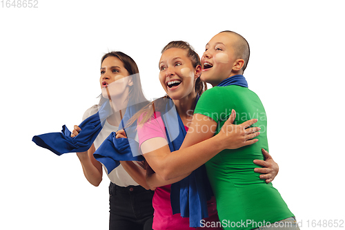 Image of Female soccer fans cheering for favourite sport team with bright emotions isolated on white studio background