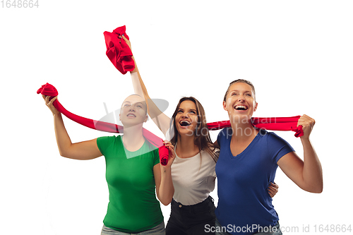 Image of Female soccer fans cheering for favourite sport team with bright emotions isolated on white studio background