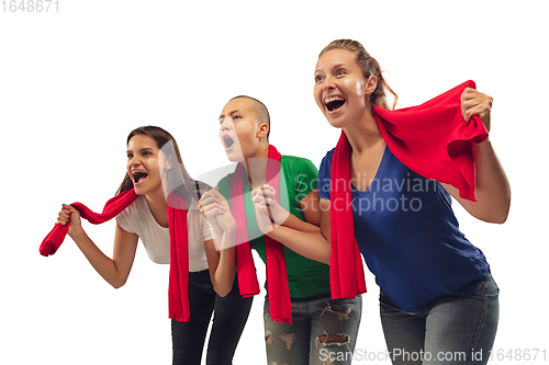 Image of Female soccer fans cheering for favourite sport team with bright emotions isolated on white studio background