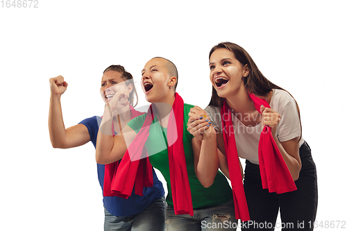 Image of Female soccer fans cheering for favourite sport team with bright emotions isolated on white studio background