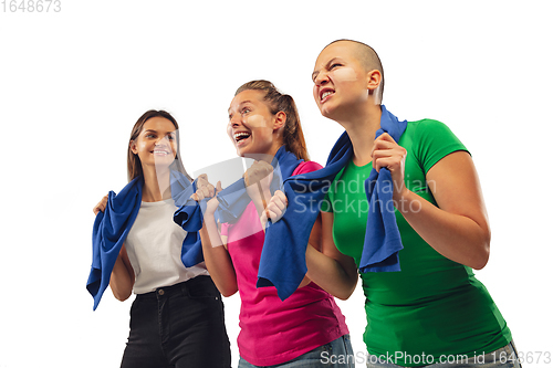 Image of Female soccer fans cheering for favourite sport team with bright emotions isolated on white studio background