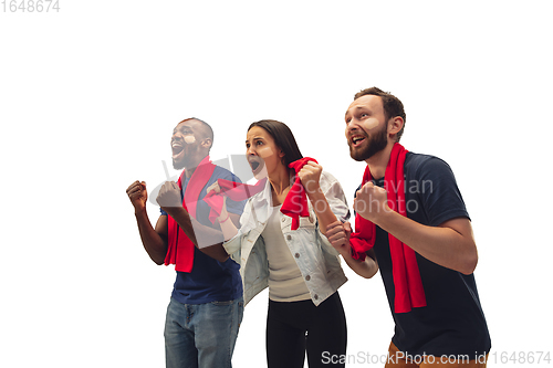 Image of Multiethnic soccer fans cheering for favourite sport team with bright emotions isolated on white studio background