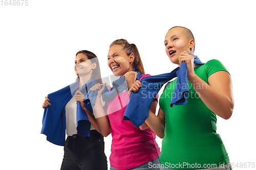 Image of Female soccer fans cheering for favourite sport team with bright emotions isolated on white studio background