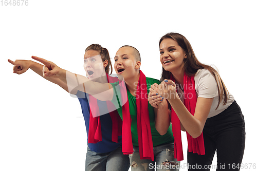 Image of Female soccer fans cheering for favourite sport team with bright emotions isolated on white studio background