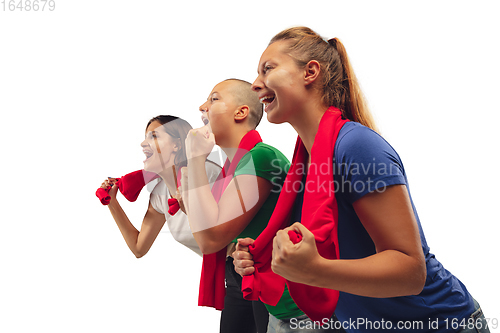 Image of Female soccer fans cheering for favourite sport team with bright emotions isolated on white studio background