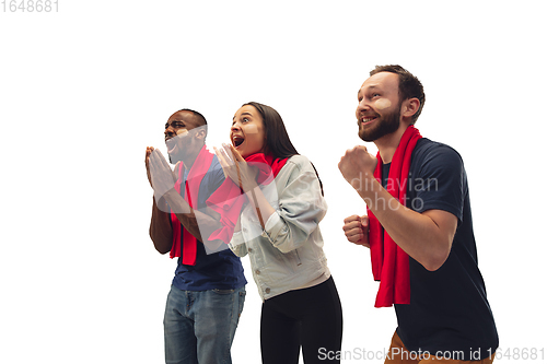 Image of Multiethnic soccer fans cheering for favourite sport team with bright emotions isolated on white studio background