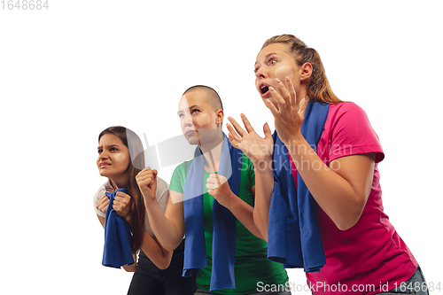 Image of Female soccer fans cheering for favourite sport team with bright emotions isolated on white studio background