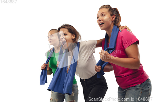 Image of Female soccer fans cheering for favourite sport team with bright emotions isolated on white studio background