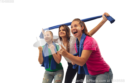 Image of Female soccer fans cheering for favourite sport team with bright emotions isolated on white studio background