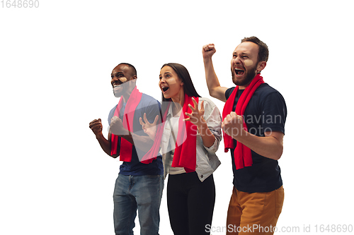 Image of Multiethnic soccer fans cheering for favourite sport team with bright emotions isolated on white studio background