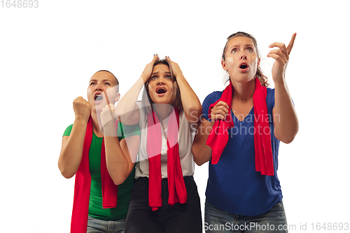 Image of Female soccer fans cheering for favourite sport team with bright emotions isolated on white studio background